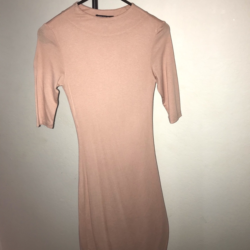 Salmon colored knee length fitted dress